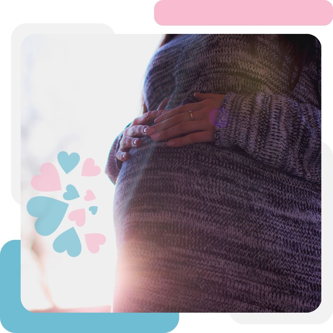 pregnant woman holding her belly