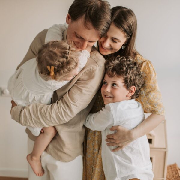 Young, happy family of four.